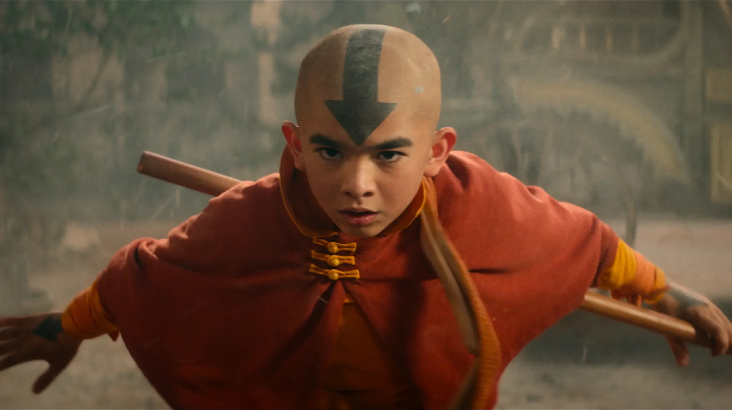 Aang, the main character from Avatar (live action show on Netflix) in a ready pose, wielding a staff. - 4