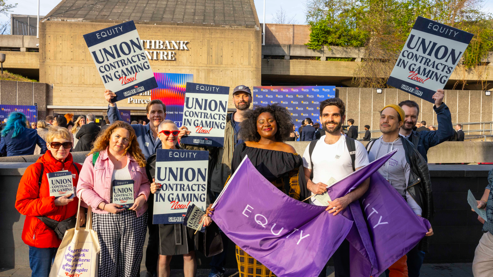 Photo of Equity protestors with placards standing outside Southbank Centre in London