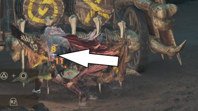 An arrow pointing to a blue star symbol under damage numbers in Monster Hunter Wilds.