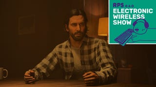 Alan Wake sits at a table, looking shocked, in Alan Wake 2. The Electronic Wireless Show logo is added in the top-right corner.
