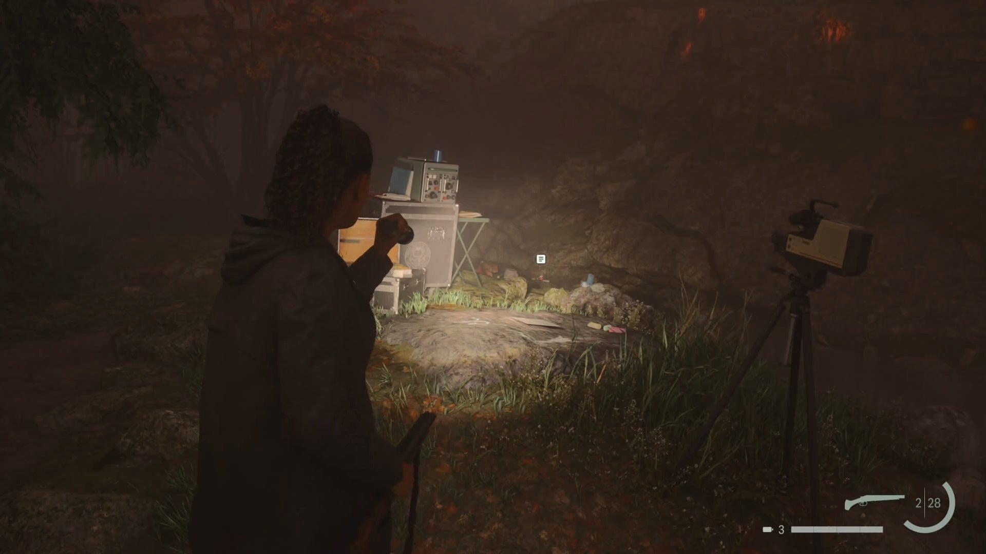 saga shining her flashlight on a nursery rhyme puzzle in a rocky area in the woods