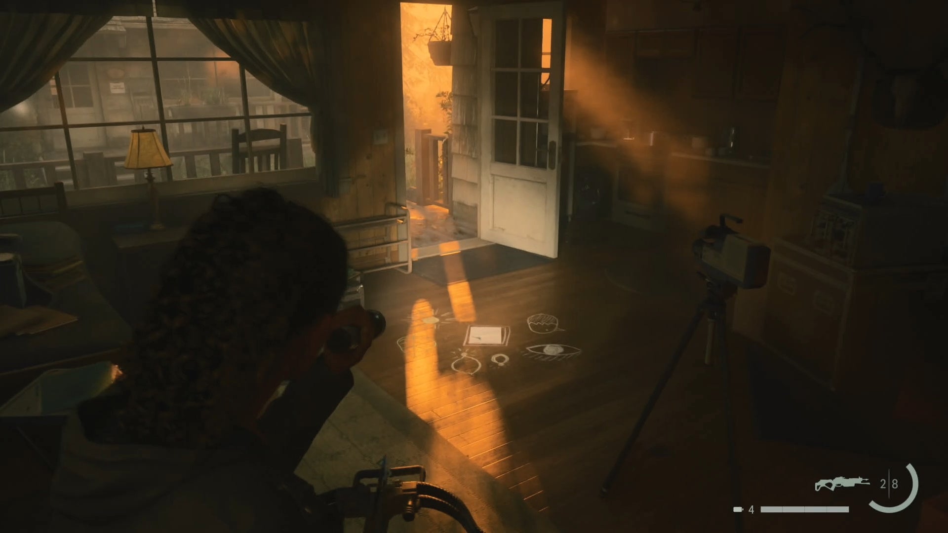 saga shining her flashlight on a nursery rhyme puzzle in the main room of a trailer with the front door open