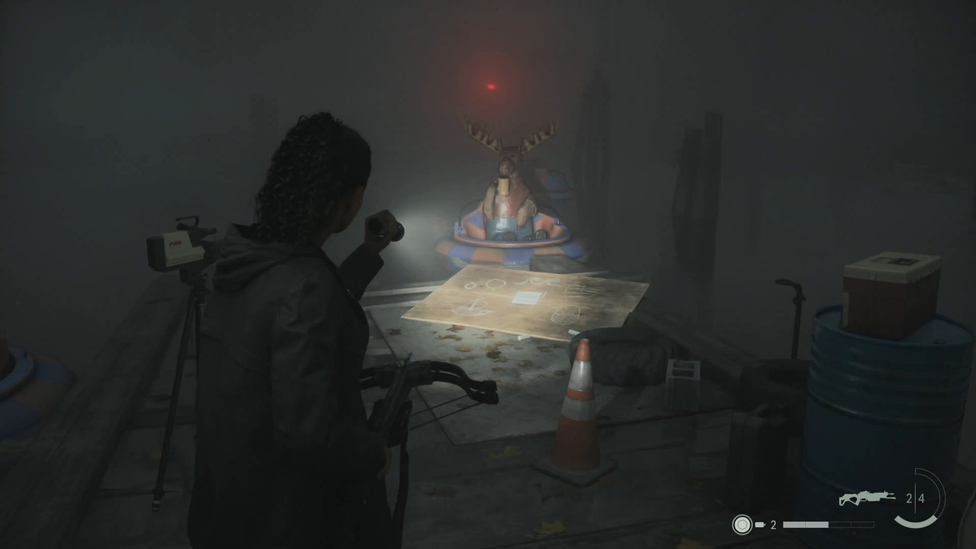 saga shining her flashlight on a nursery rhyme puzzle at the edge of a pier, with a statue of a moose floating in the water beyond