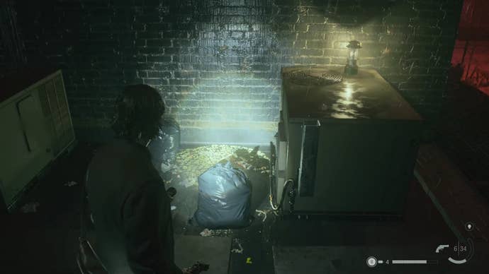 alan shining his flashlight on a word of power beside an air vent on a rooftop