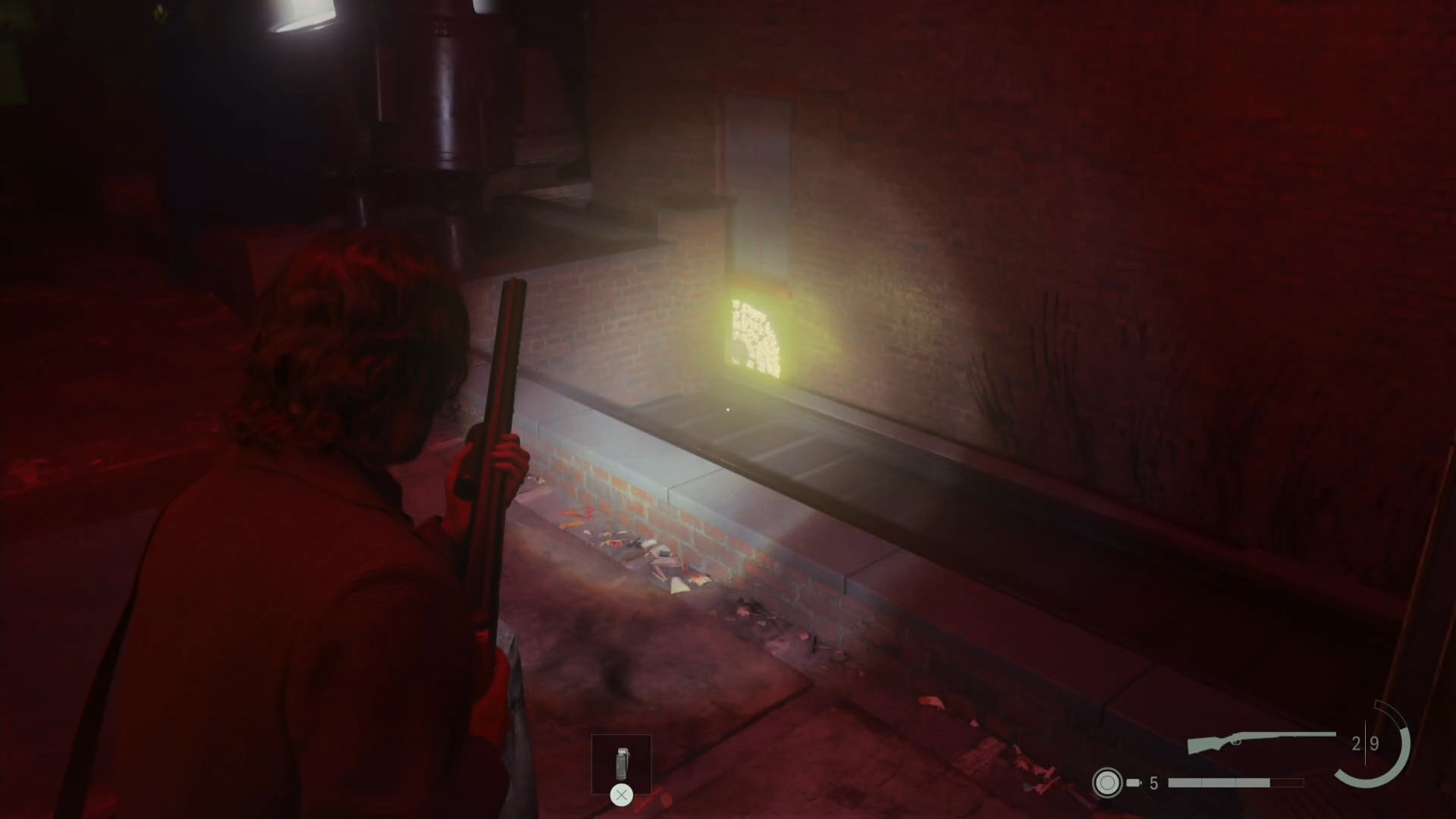 alan shining his flashlight on a word of power on wall across the way from him on a rooftop