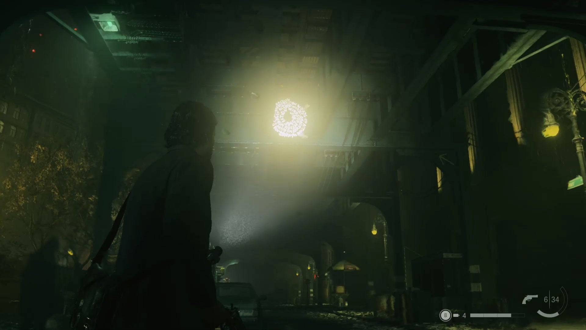 alan shining his flashlight on a word of power on a high wall