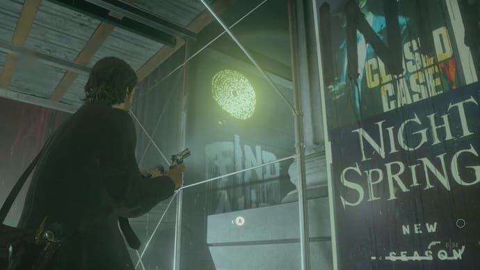 alan shining his flashlight on a word of power on a wall behind construction work with a night springs poster stuck on the construction work