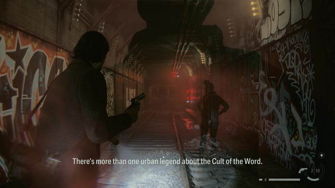 A man watches projections of two figures talking in a subway station in Alan Wake 2
