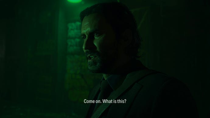 A man speaks in a dark alley in Alan Wake 2