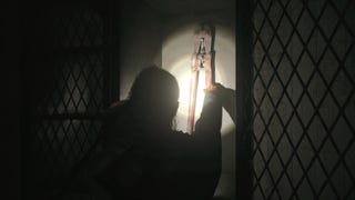 saga reaching for the bolt cutters inside a metal cabinet with her flashligh highlighting the bolt cutters