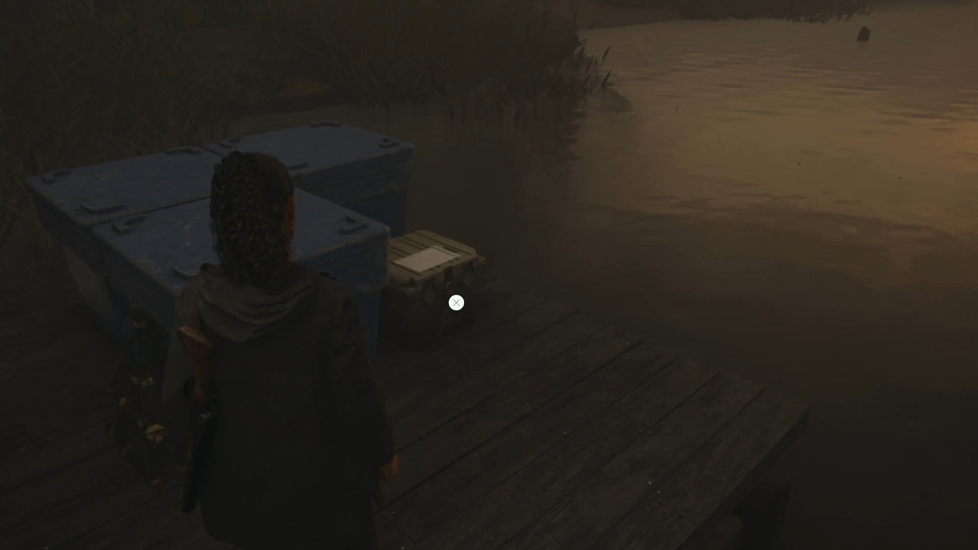 saga shining her flashlight on a cult stash on a wooden pier with water to the right