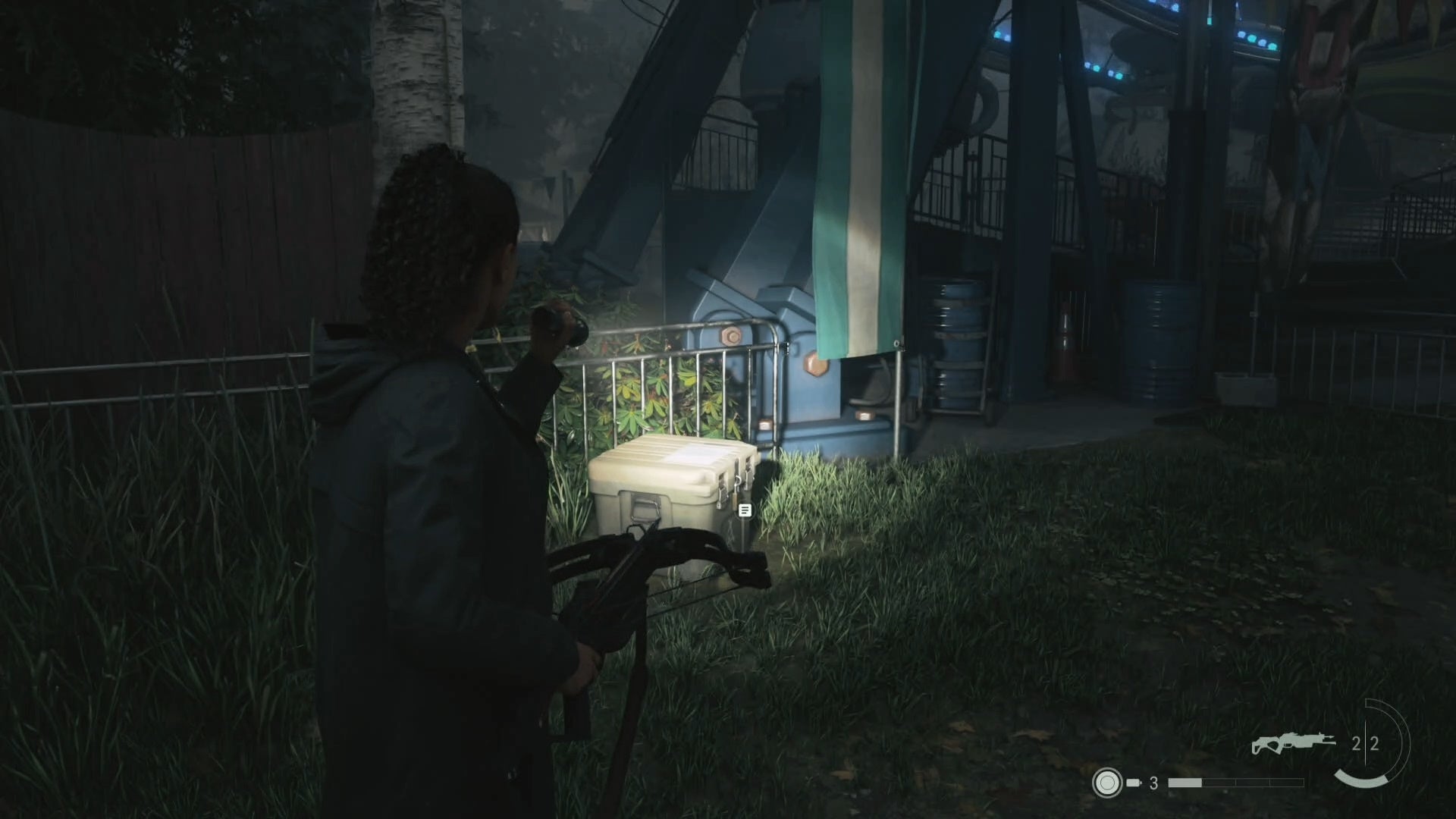 saga shining her flashlight on a cult stash near a ferris wheel