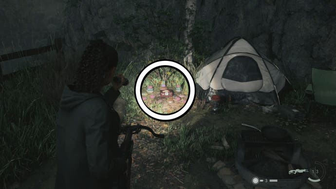 saga shining her flashlight on a lunch box beside a white tent, in a forest