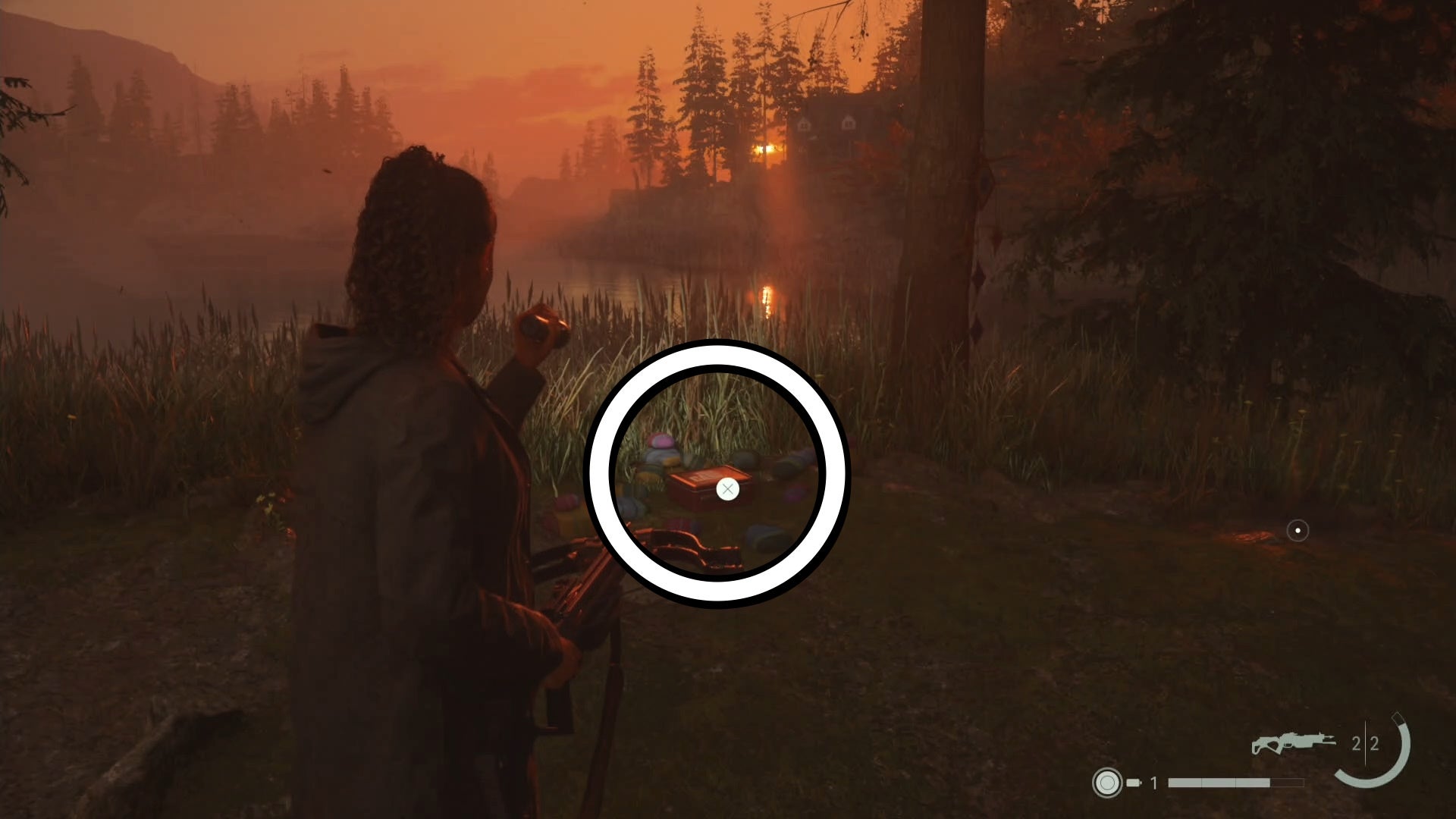 saga shining her flashlight on a lunch box in a forest, near a body of water