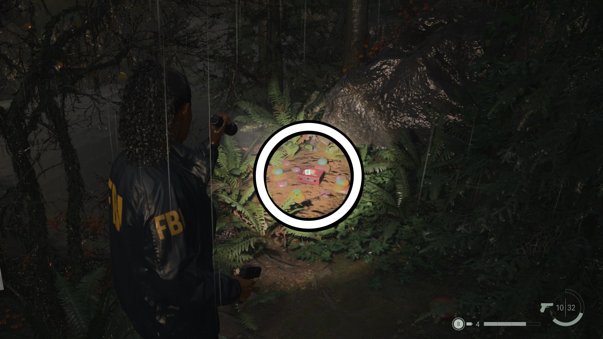 saga shining her flashlight on a lunch box on a forest floor