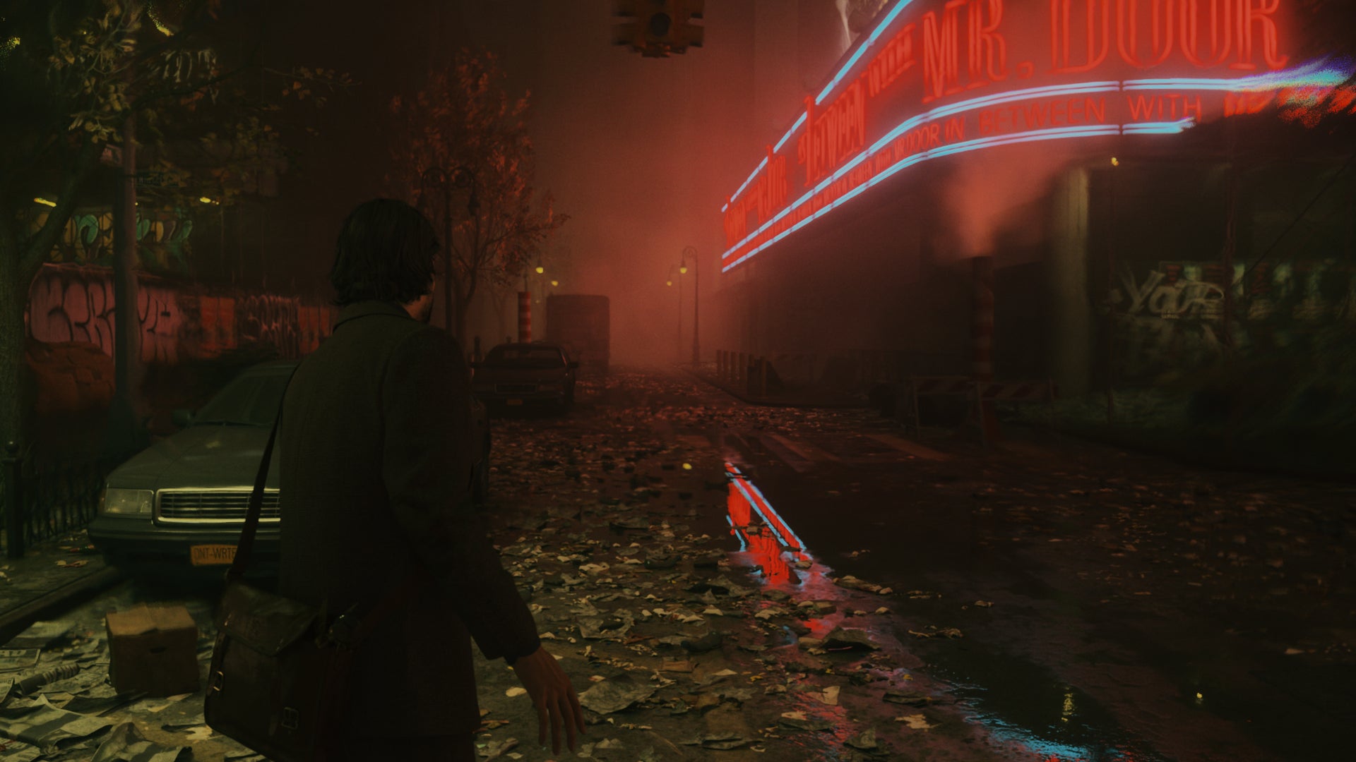Alan stands on a deserted Manhattan street in Alan Wake 2, with path tracing enabled. - 5
