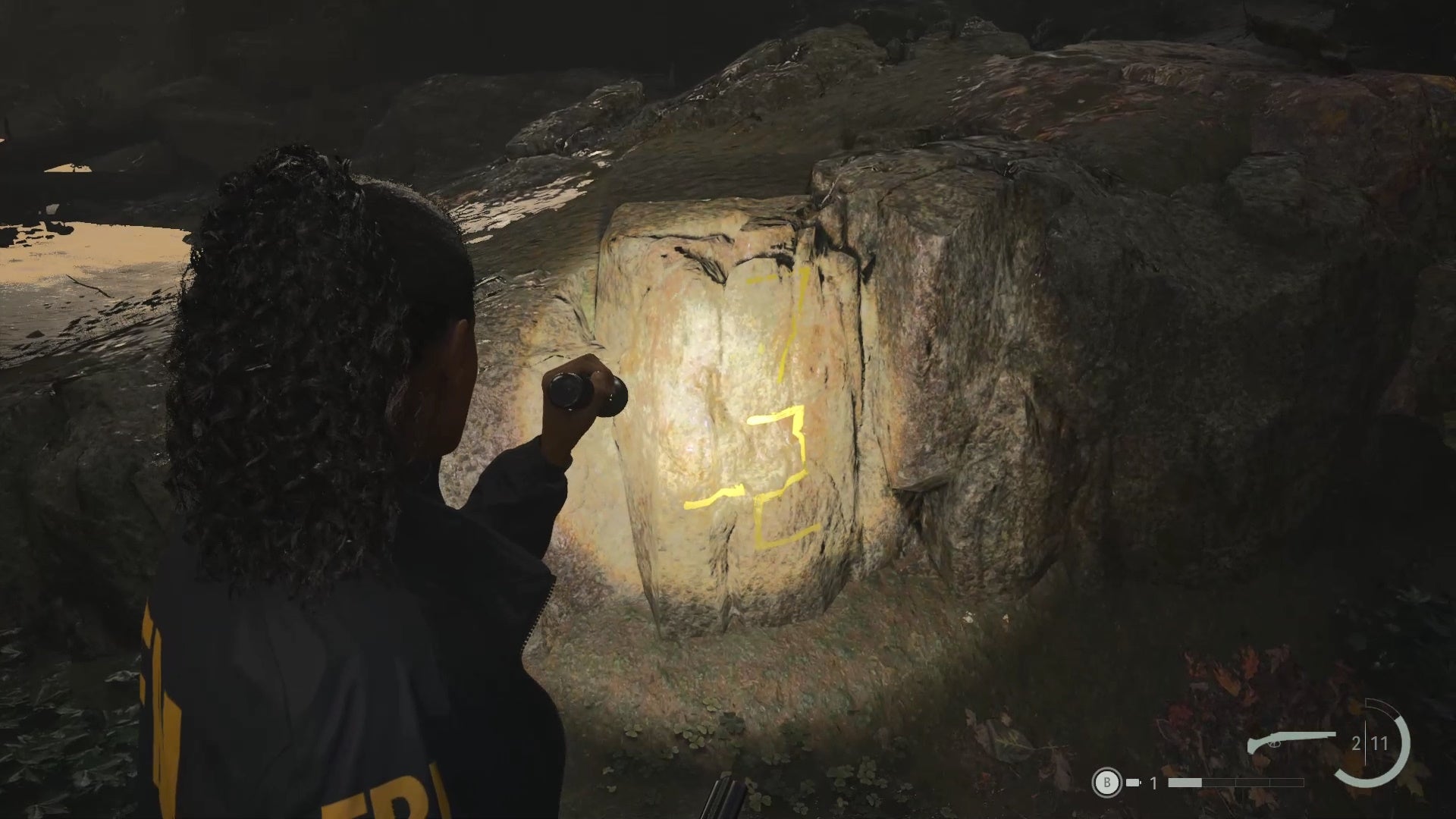 saga shining her flashlight on yellow writing that reads &lsquo;7 + 2&rsquo;