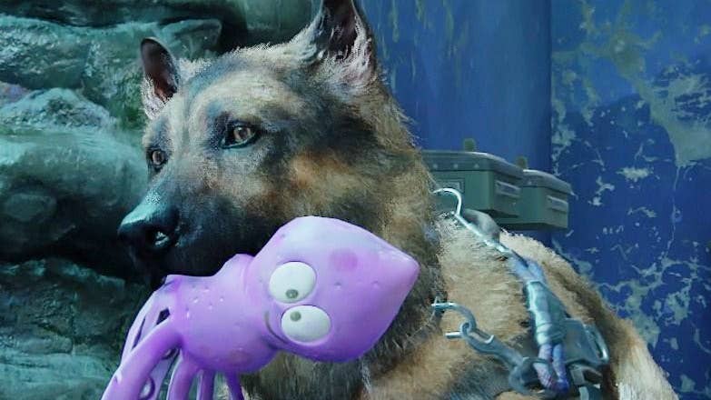 Alice the dog holds a purple squid toy in her mouth in The Last of Us Part 2