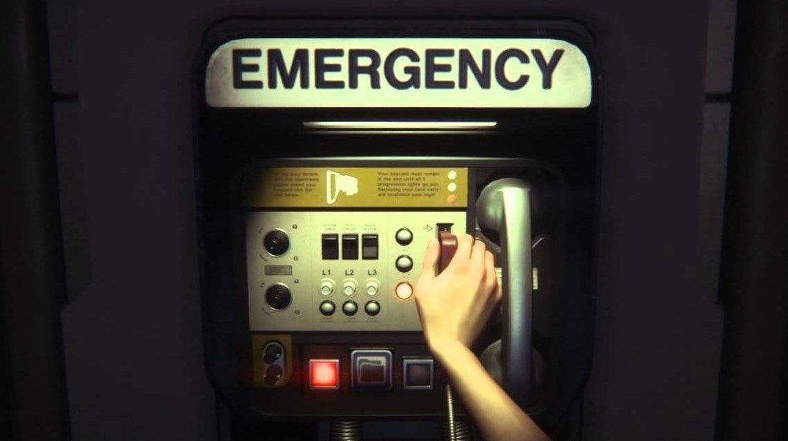 The phone from Alien Isolation with the player character's hand on the switch - 1