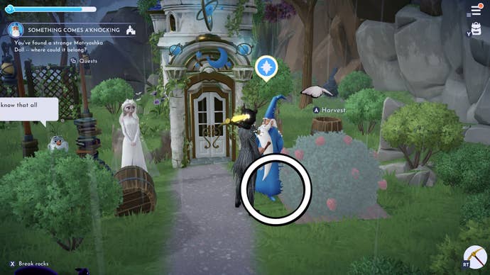 a doll location circled under merlin’s feet outside his house in the peaceful meadow area in disney dreamlight valley with else standing to the left