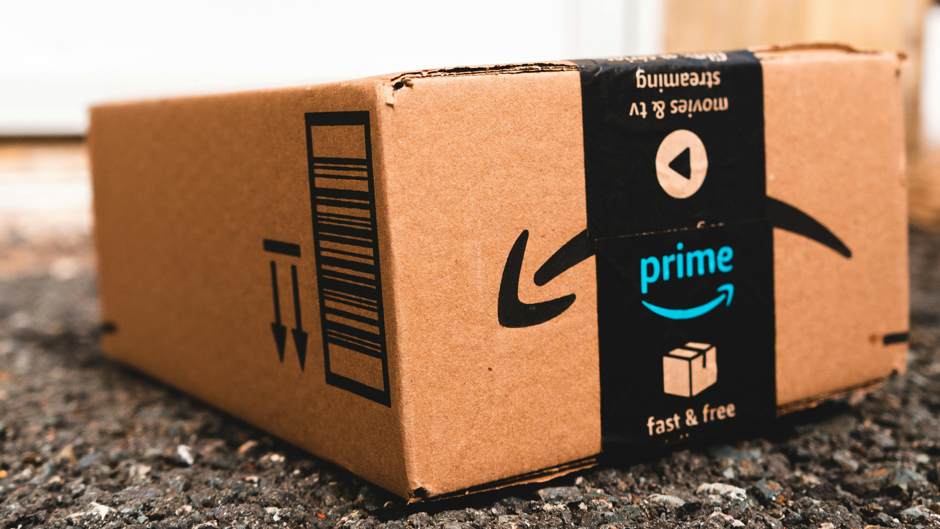 Amazon delivery package with the prime logo on the tape.