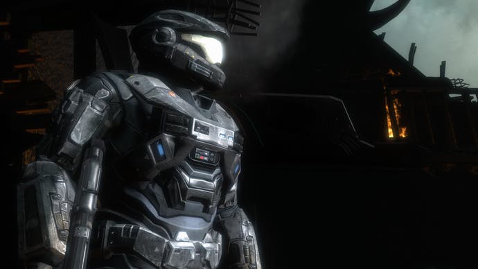 An armored soldier surveys the scene in Halo: Reach
