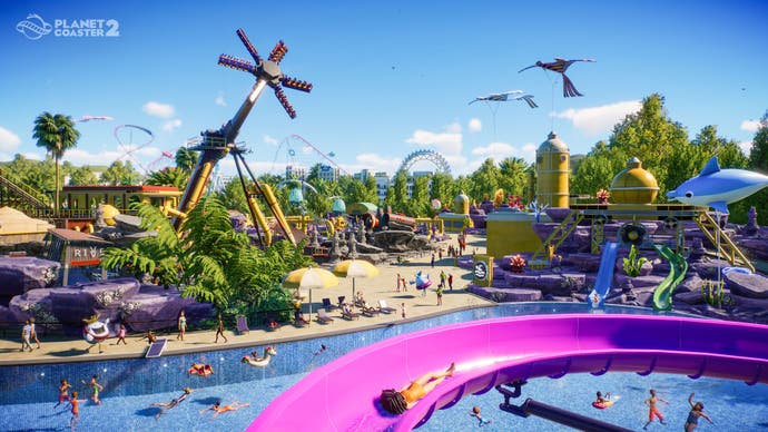 Ein Screenshot von Planet Coaster 2, der einen weiten Blick auf einen Wasserpark zeigt