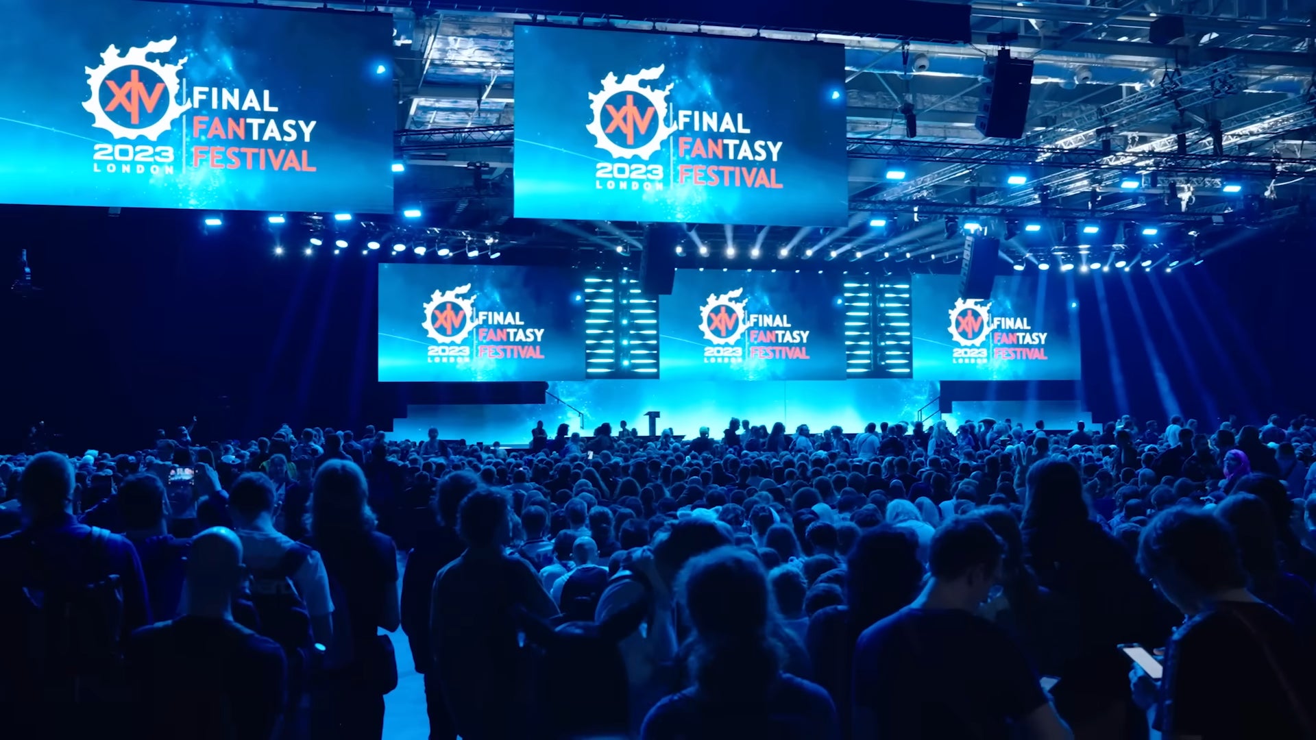 Final Fantasy 14 Fan Fest trailer screenshot showing image of crowds watching screens with the Fan Fest logo