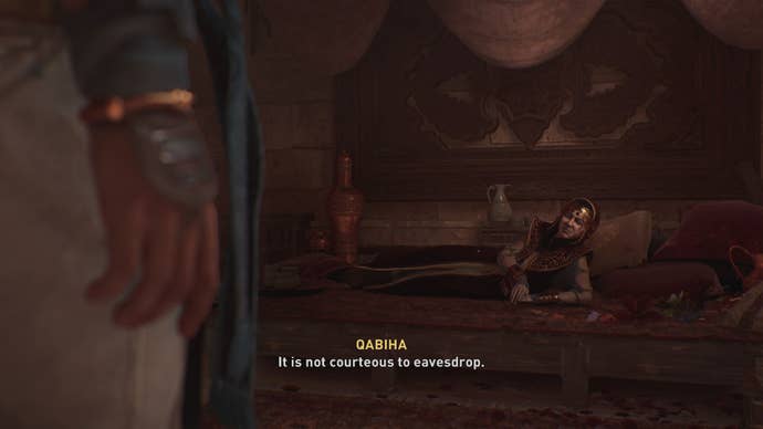 Basim approaches and speaks to perfume seller Qabiha in the Bazaar in Assassin’s Creed Mirage