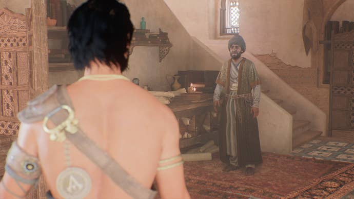 Basim speaks with Ahmad’s assistant, Hamid, in his office in Assassin’s Creed Mirage