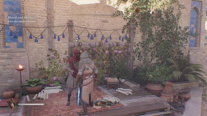Basim speaks with a Munadi in Assassin’s Creed Mirage