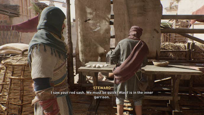 Basim speaks with a Steward in the Great Garrison in Assassin’s Creed Mirage