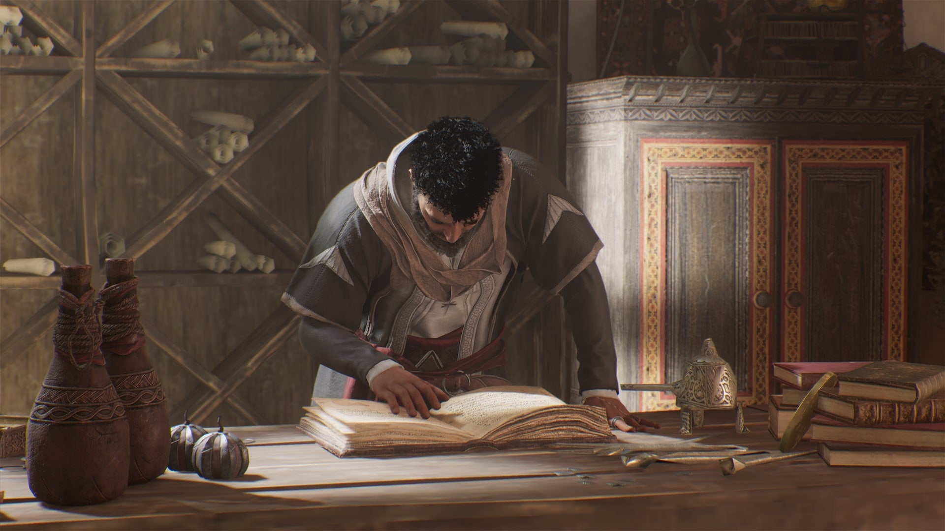 An NPC reads a book on a desk in one of the Hidden Ones Bureaus in Assassin&rsquo;s Creed Mirage