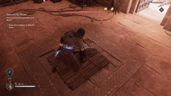 Basim interacts with a trapdoor in the Great Garrison that leads to Wasif’s chamber in Assassin’s Creed Mirage