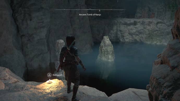 Naoe in a cave with water in Assassin’s Creed Shadows.
