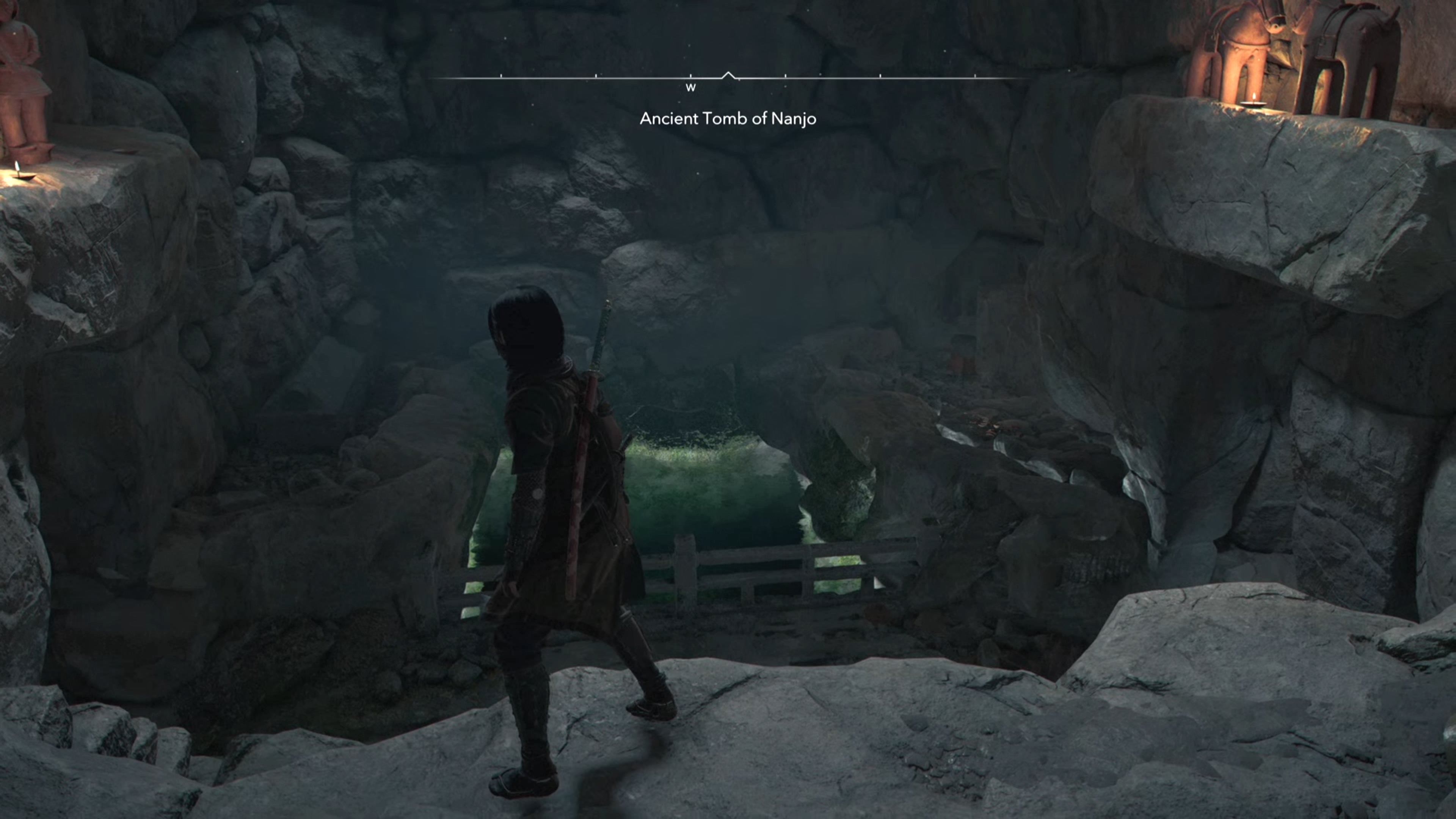 Naoe in a cave with a square of water in Assassin&rsquo;s Creed Shadows.