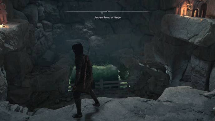 Naoe in a cave with a square of water in Assassin’s Creed Shadows.
