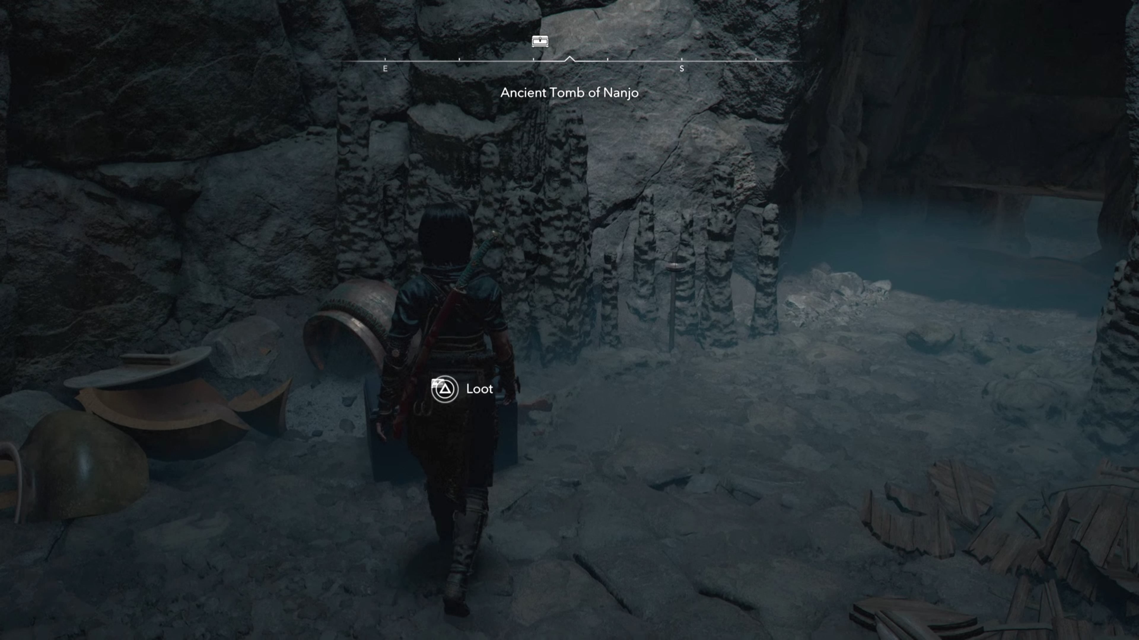 Naoe looking at a chest in a cave in Assassin&rsquo;s Creed Shadows.