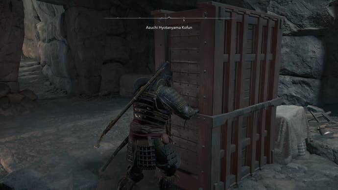 Yasuke pushing a block inside the Azuchi Kyotanyama Kofun in Assassin’s Creed Shadows.