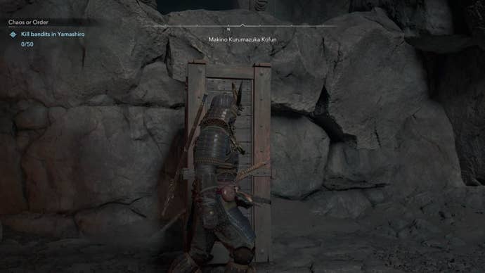 Yasuke beside a wooden block in Assassin’s Creed Shadows.