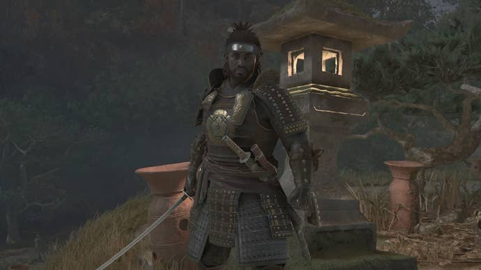 Yasuke brandishing his sword outside of the Megalithic Vault Kofun in Assassin’s Creed Shadows.
