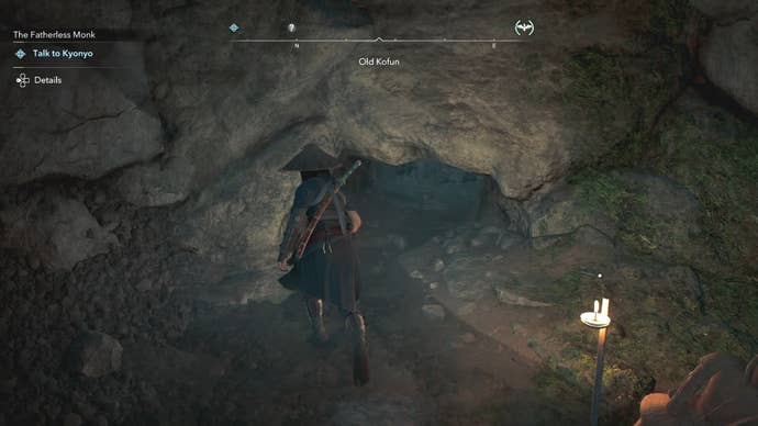 Naoe standing beside a gap in a wall inside the Old Kofun in Assassin’s Creed Shadows.