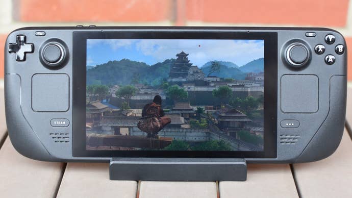 Naoe looks out over Osaka in Assassin’s Creed Shadows, running on the Steam Deck.