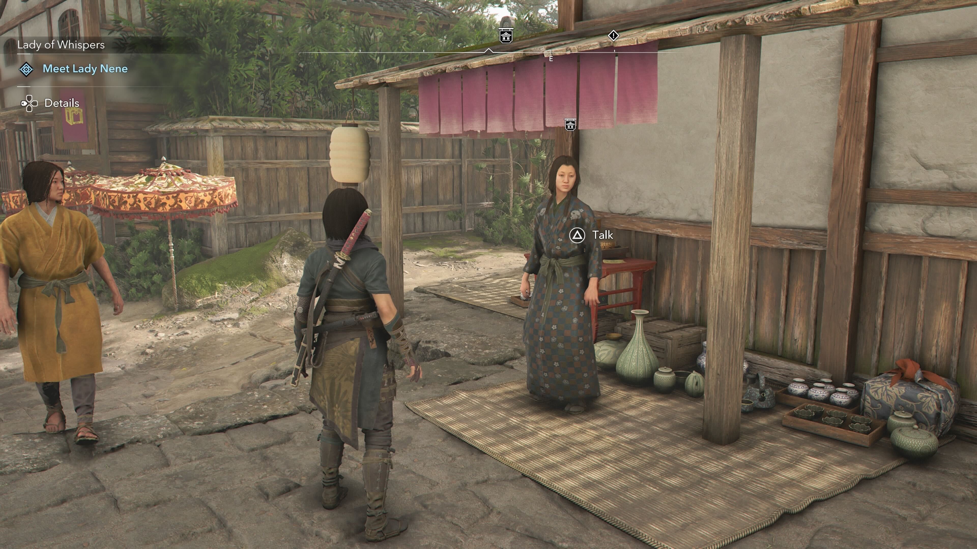 Naoe looking at an Ornament Vendor that sells a tea bowl in Assassin&rsquo;s Creed Shadows.