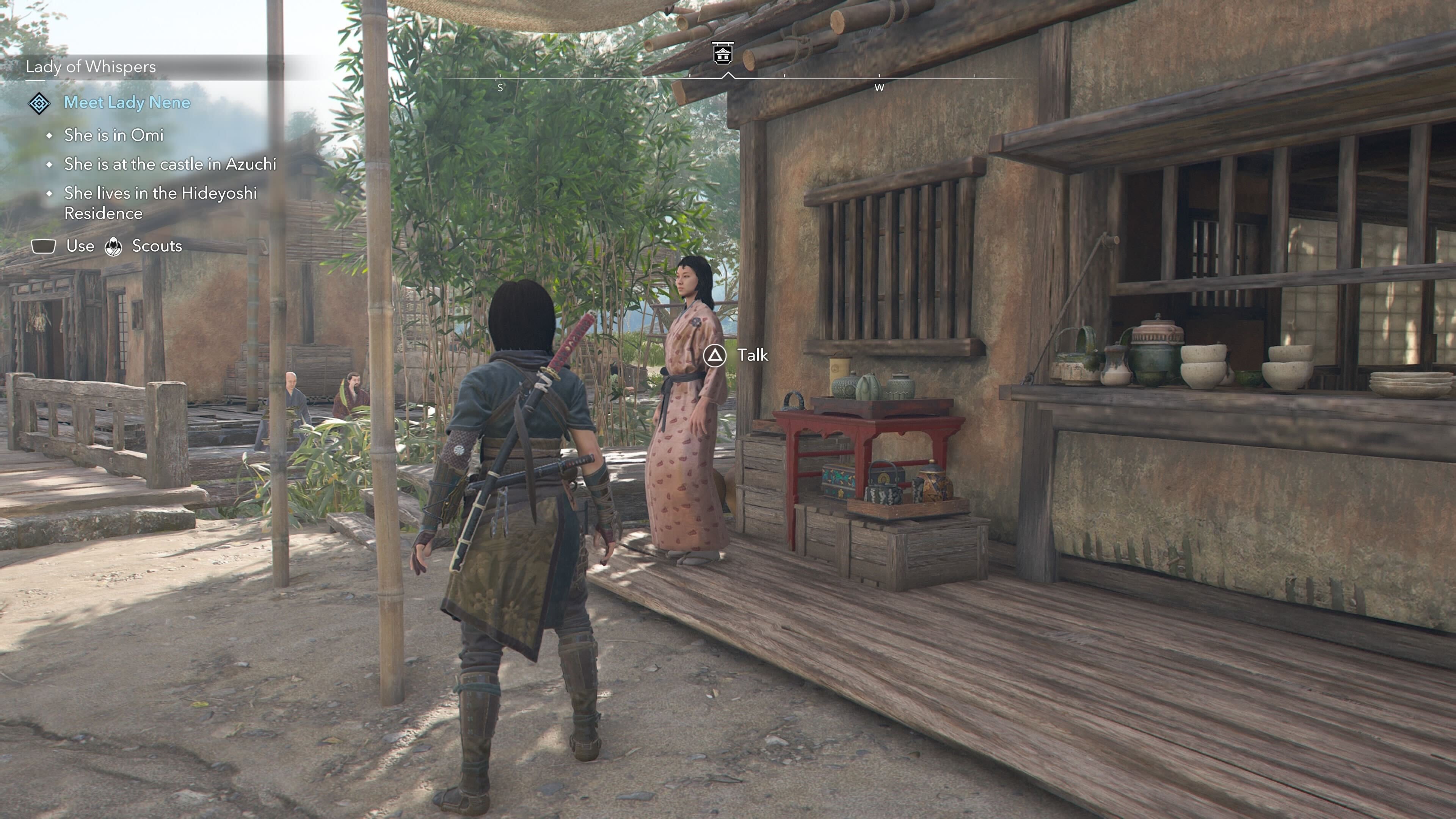 Naoe looking at an Ornament Vendor that sells a tea bowl in Assassin&rsquo;s Creed Shadows.