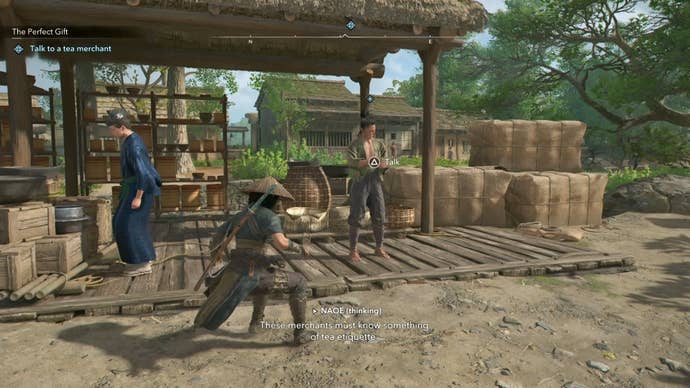 Naoe standing in front of the tea merchant in Assassin’s Creed Shadows.