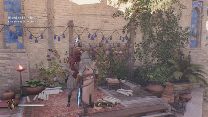 Basim speaks with a Munadi in Assassin's Creed Mirage