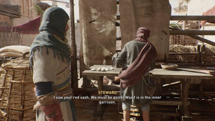 Basim speaks with a Steward in the Great Garrison in Assassin's Creed Mirage