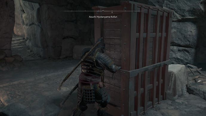 Yasuke pushing a block inside Azuchi Kyotanyama Kofun in Assassin's Creed Shadows.