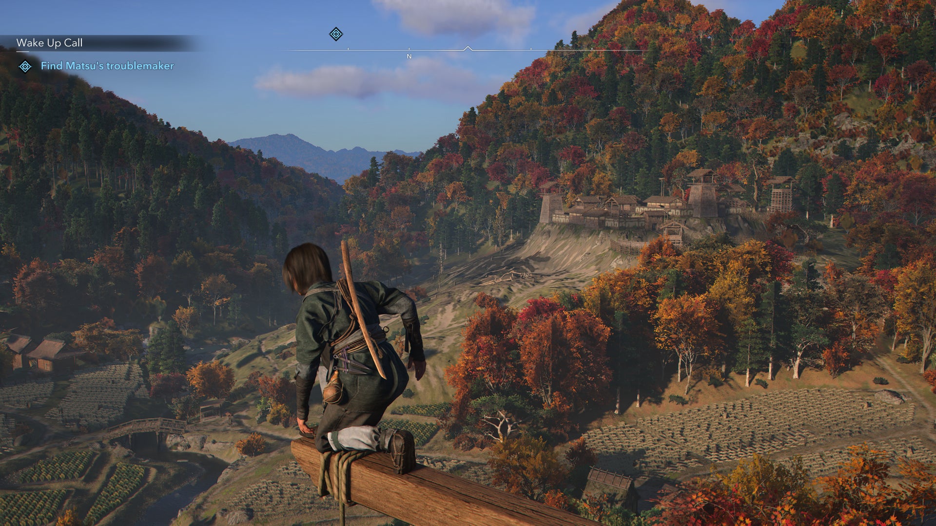 Naoe looks out upon a lush valley in Assassin's Creed Shadows. - 6
